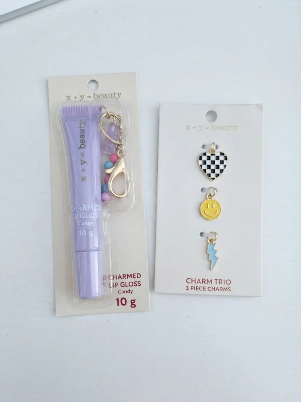 NIP x + y = beauty Charmed Lip Gloss (Candy) & 3-Piece Charm Trio Set  (0218)